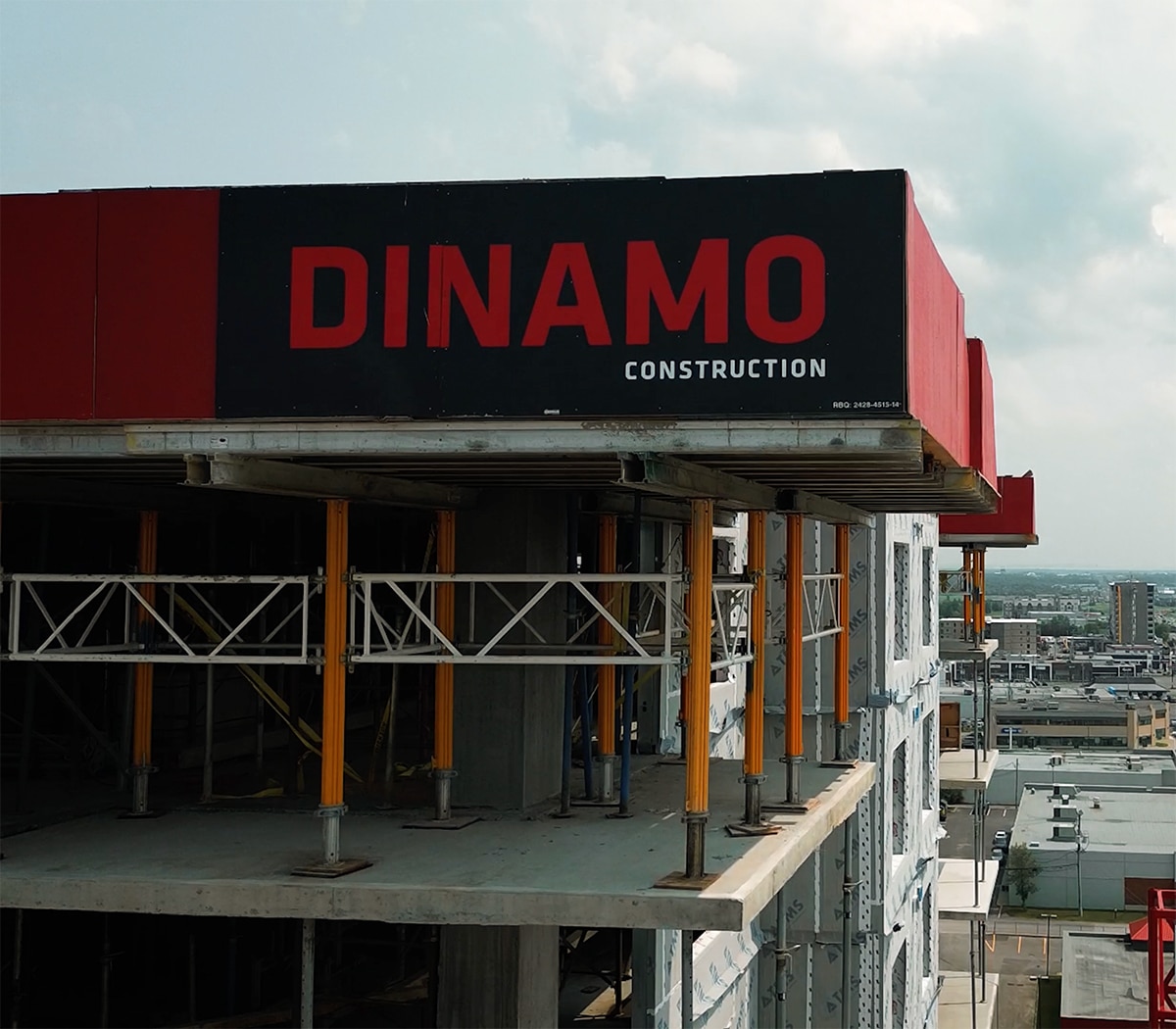 A high-angle view of a building under construction by Dinamo Construction.